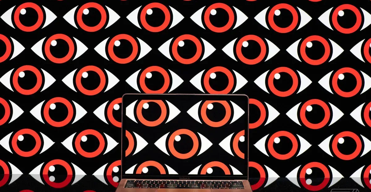 Art depicting a pattern of repeating eyeballs over a computer screen.
